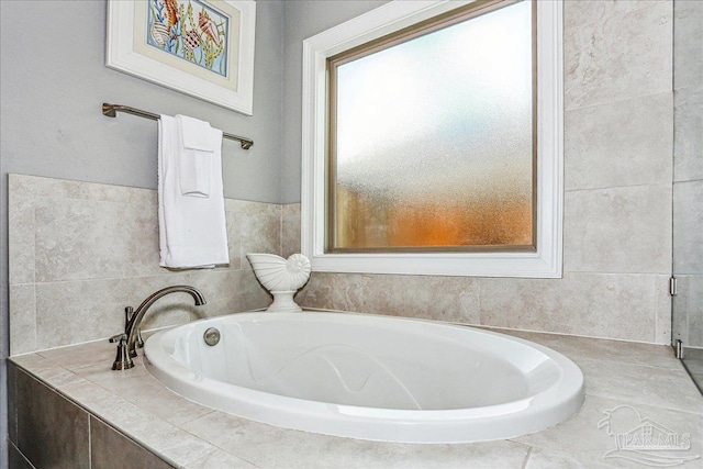 full bath with a bath