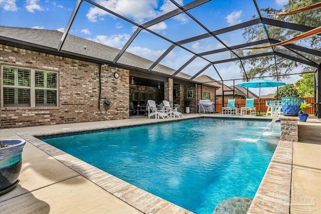 pool featuring a patio, a grill, and glass enclosure