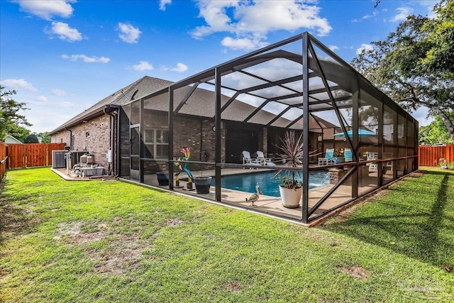 view of swimming pool featuring a fenced backyard, a patio area, a fenced in pool, and a yard