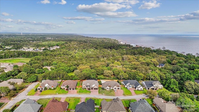 aerial view with a water view, a forest view, and a residential view