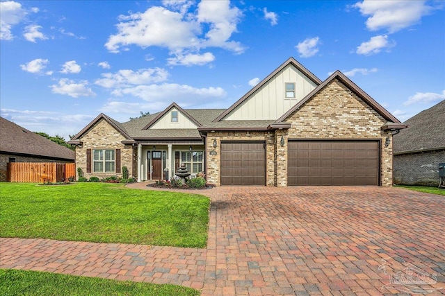 craftsman house featuring board and batten siding, fence, decorative driveway, an attached garage, and a front lawn