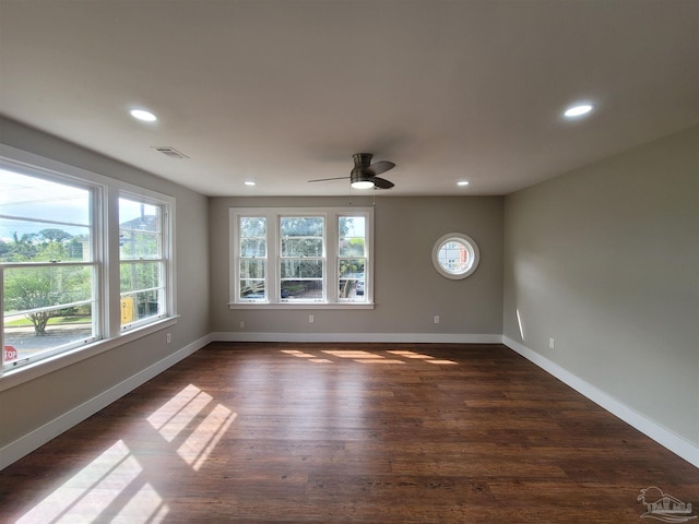 empty room featuring dark hardwood / wood-style floors and ceiling fan