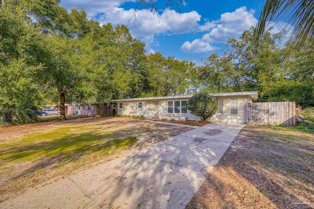 ranch-style house with a front lawn