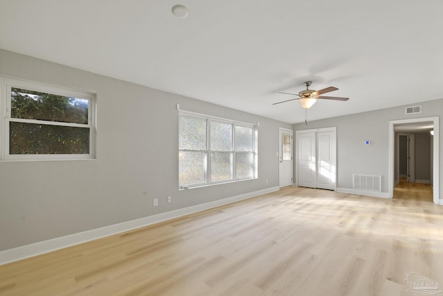 unfurnished room featuring light hardwood / wood-style floors and ceiling fan