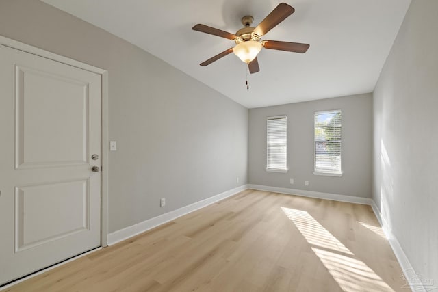 empty room featuring ceiling fan and light hardwood / wood-style flooring