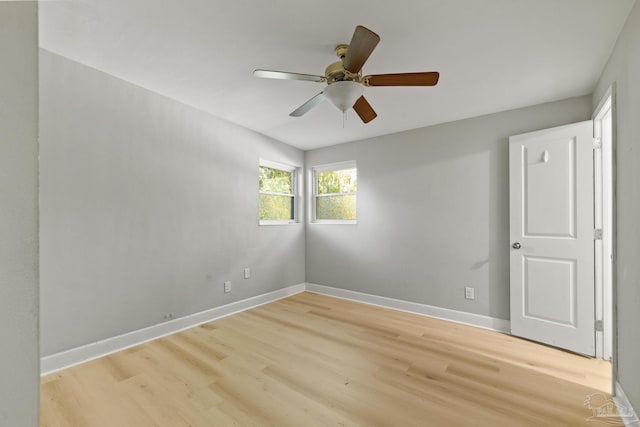 spare room featuring light hardwood / wood-style flooring and ceiling fan