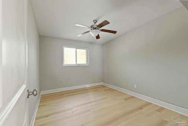 spare room with light hardwood / wood-style flooring and ceiling fan