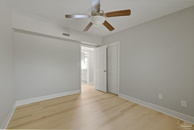 unfurnished room featuring light hardwood / wood-style flooring and ceiling fan