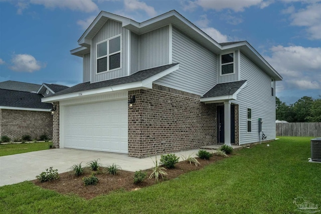 view of front of house featuring a garage and a front lawn