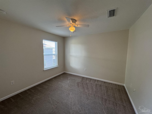 unfurnished room with visible vents, carpet flooring, baseboards, and ceiling fan