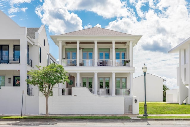 view of front of property with a balcony