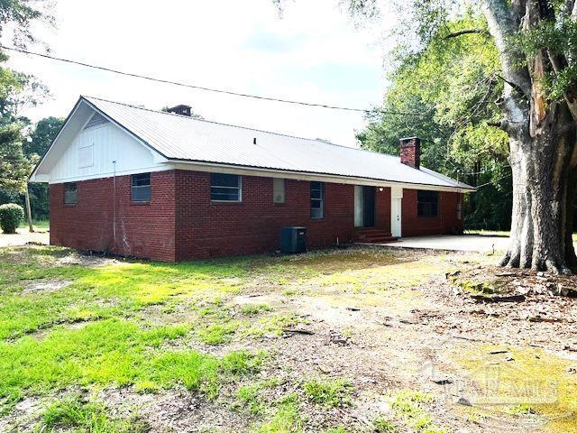 back of house featuring a patio and central AC unit