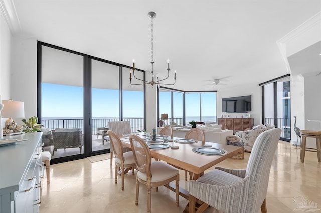 dining room with a wall of windows, a water view, an inviting chandelier, and light tile patterned floors