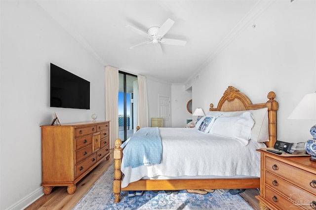 bedroom with access to exterior, light wood-style floors, baseboards, crown molding, and a ceiling fan