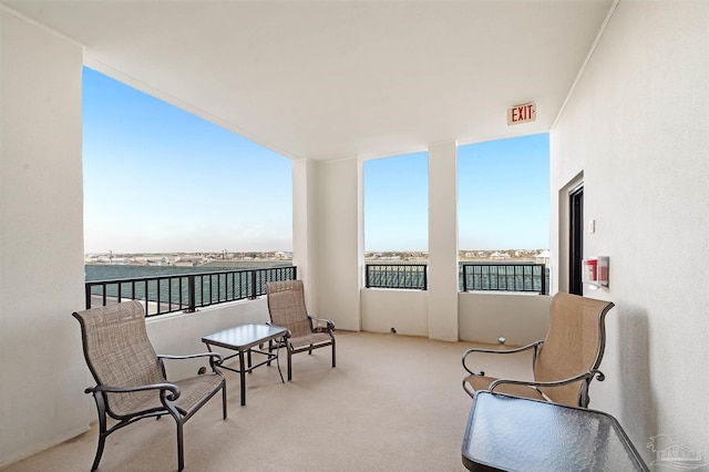 balcony featuring a water view