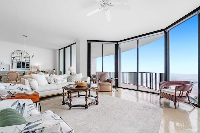 living room featuring floor to ceiling windows, a water view, light tile patterned flooring, and a wealth of natural light