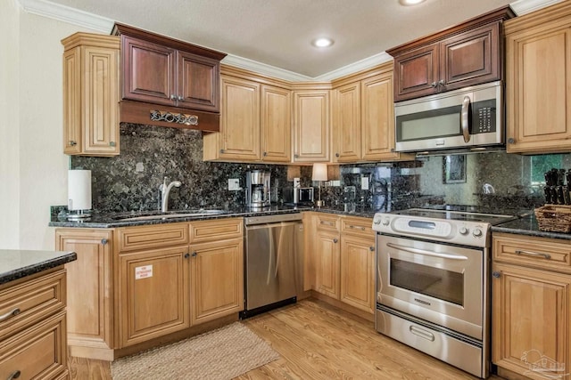 kitchen with stainless steel appliances, light hardwood / wood-style floors, decorative backsplash, sink, and ornamental molding