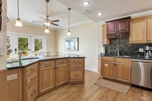 kitchen featuring stainless steel dishwasher, ceiling fan, sink, and light hardwood / wood-style flooring