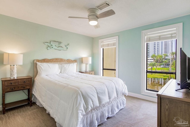 bedroom with light carpet and ceiling fan