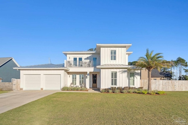 view of front of property with a balcony, a front yard, and a garage