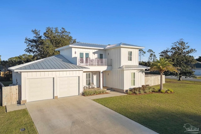 view of front of house with a balcony, a front lawn, and a garage