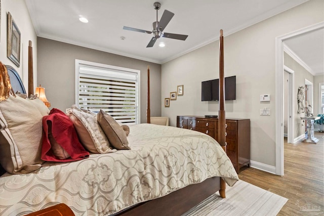 bedroom with crown molding, recessed lighting, a ceiling fan, wood finished floors, and baseboards