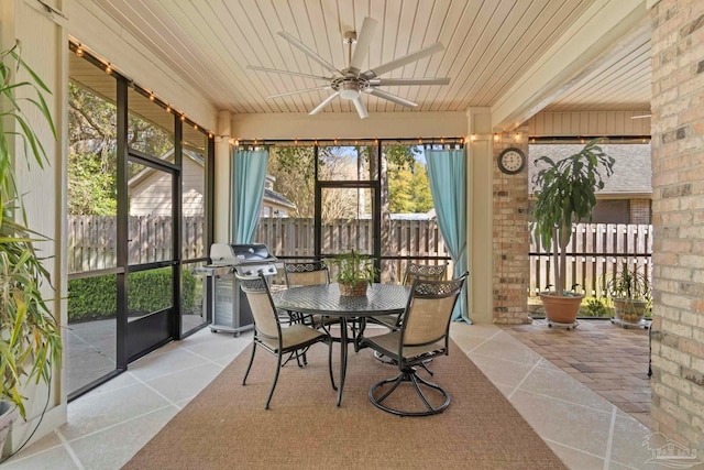 sunroom / solarium with wooden ceiling and ceiling fan