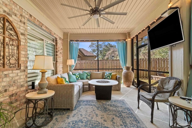 sunroom with wooden ceiling and ceiling fan