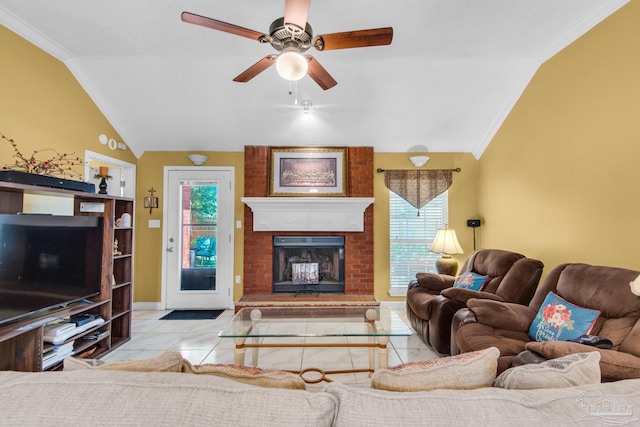 living room with ornamental molding, a fireplace, vaulted ceiling, and plenty of natural light