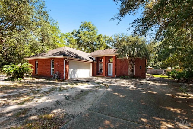 single story home featuring a garage