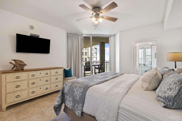 bedroom with a textured ceiling, access to outside, and ceiling fan