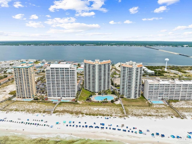 bird's eye view with a water view and a view of the beach