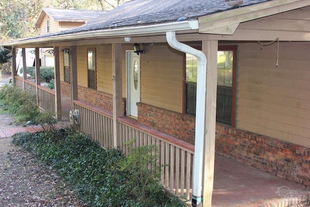 view of property exterior featuring covered porch