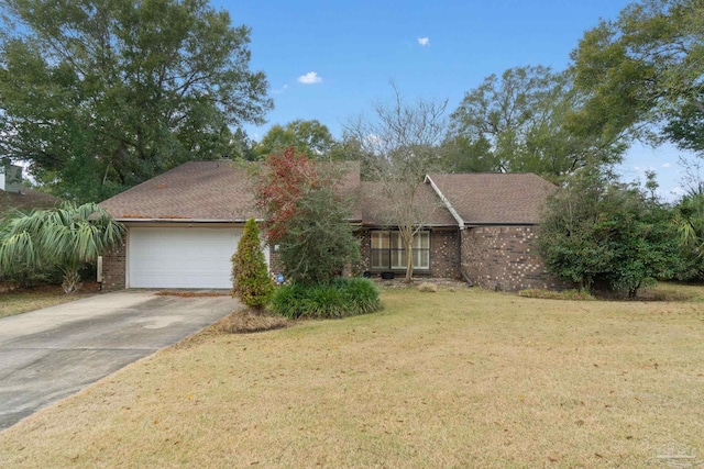 view of front of house featuring a garage and a front lawn