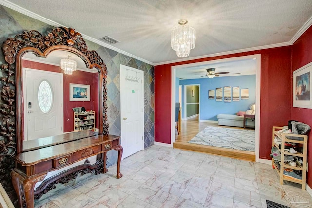 14574 N County Rd 65, Foley, AL 36535 - foyer featuring a chandelier, ornamental molding, a ceiling fan, a textured ceiling, and marble look tile flooring