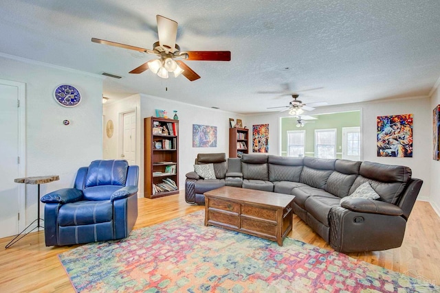 14574 N County Rd 65, Foley, AL 36535 - living area with ceiling fan, light wood-type flooring, crown molding, and a textured ceiling