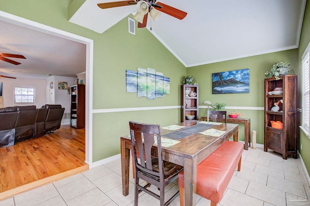 14574 N County Rd 65, Foley, AL 36535 - dining space featuring a ceiling fan, light tile patterned flooring, vaulted ceiling, ornamental molding, and baseboards