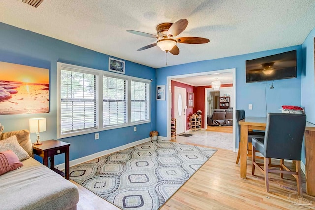 14574 N County Rd 65, Foley, AL 36535 - bedroom with a textured ceiling, wood finished floors, baseboards, and ceiling fan