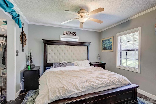 14574 N County Rd 65, Foley, AL 36535 - bedroom featuring a textured ceiling, ornamental molding, baseboards, and a ceiling fan