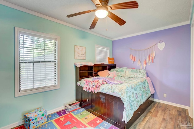 14574 N County Rd 65, Foley, AL 36535 - bedroom with crown molding, baseboards, wood finished floors, and a ceiling fan