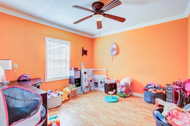 14574 N County Rd 65, Foley, AL 36535 - rec room with crown molding, ceiling fan, wood finished floors, baseboards, and a textured ceiling