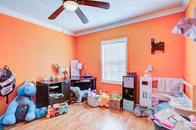 14574 N County Rd 65, Foley, AL 36535 - game room with ornamental molding, wood finished floors, ceiling fan, and a textured ceiling