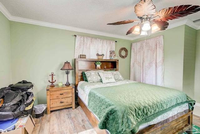 14574 N County Rd 65, Foley, AL 36535 - bedroom with ornamental molding, wood finished floors, ceiling fan, and a textured ceiling