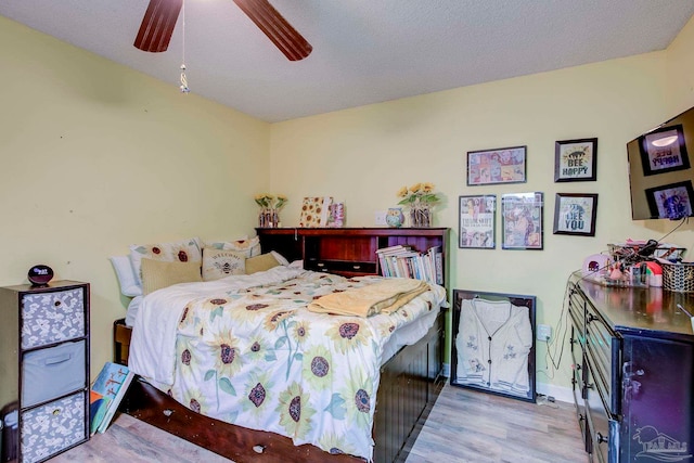 14574 N County Rd 65, Foley, AL 36535 - bedroom with wood finished floors, baseboards, and a ceiling fan