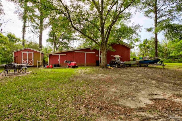 14574 N County Rd 65, Foley, AL 36535 - view of grassy yard featuring an outdoor structure and a pole building