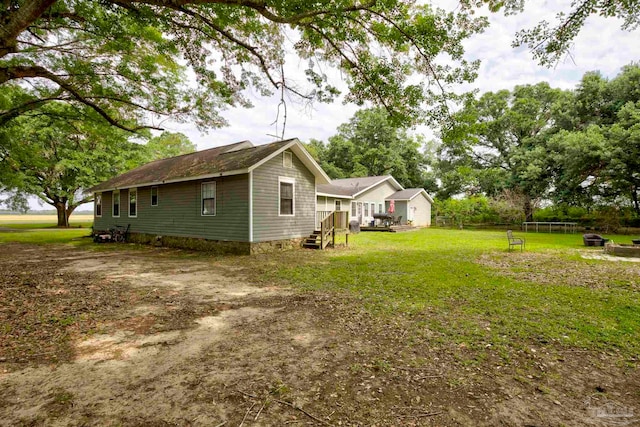 14574 N County Rd 65, Foley, AL 36535 - view of home's exterior with a lawn and a wooden deck