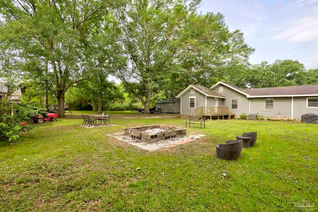 14574 N County Rd 65, Foley, AL 36535 - view of green lawn with a wooden deck