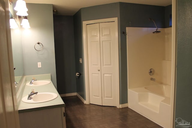 bathroom with shower / tub combination, parquet flooring, and vanity