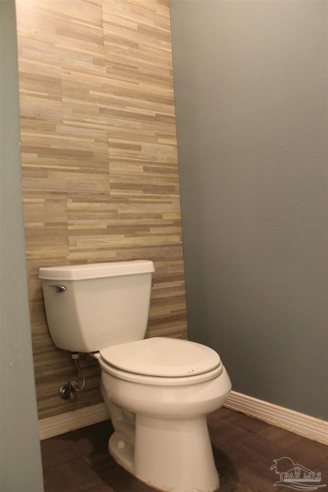 bathroom featuring hardwood / wood-style floors and toilet