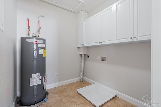 5456 Pensacola Ave, Orange Beach, AL 36561 - washroom featuring light tile patterned floors, water heater, hookup for an electric dryer, and cabinet space